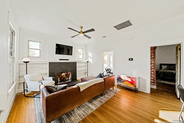 a living room with furniture and a fireplace