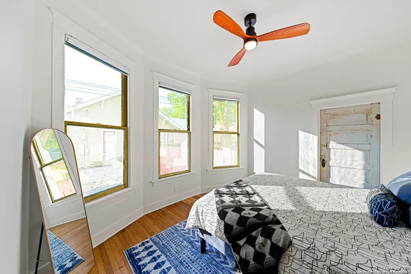 a bedroom with bed and a window