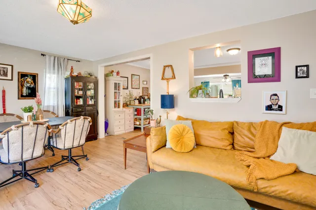 a living room with furniture and a rug