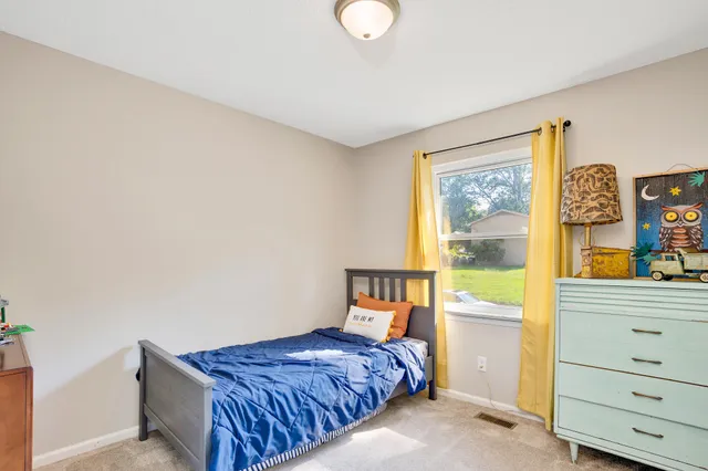a bedroom with a bed and a cabinets