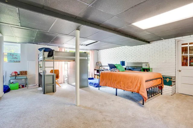 a blue bed sitting in a room