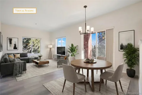a dining room with furniture window and wooden floor