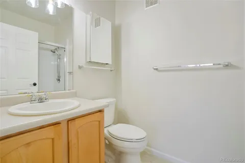 a bathroom with a sink toilet and vanity