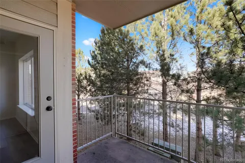 a view of balcony with tree