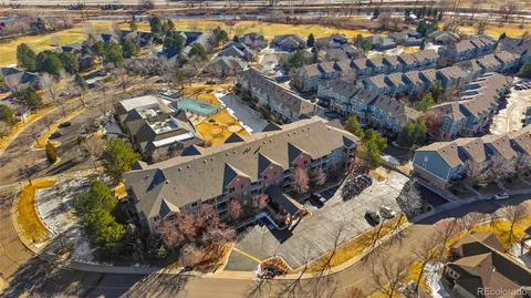 an aerial view of a house with a swimming pool