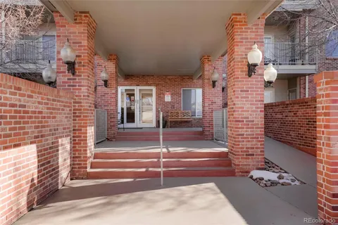 a view of a brick building with many windows