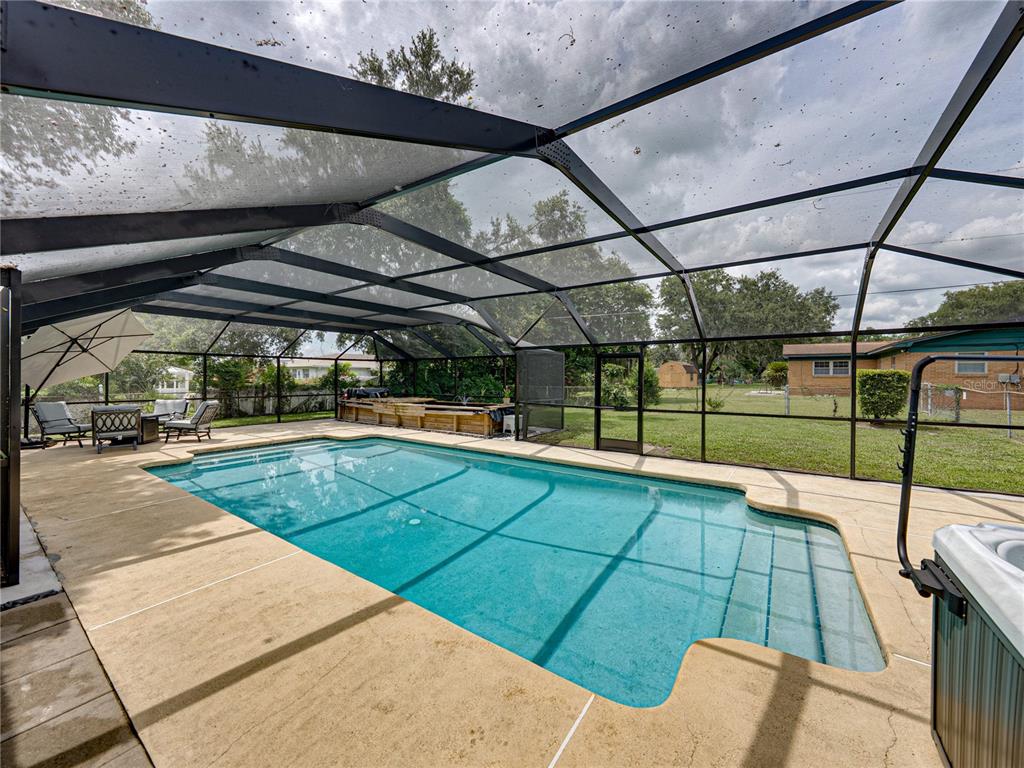 609 West Pipkin Road Lakeland, FL 33813 - Photo 47 of 72 a view of a swimming pool with a patio
