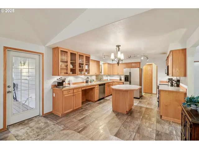 a kitchen with a sink and a stove top oven