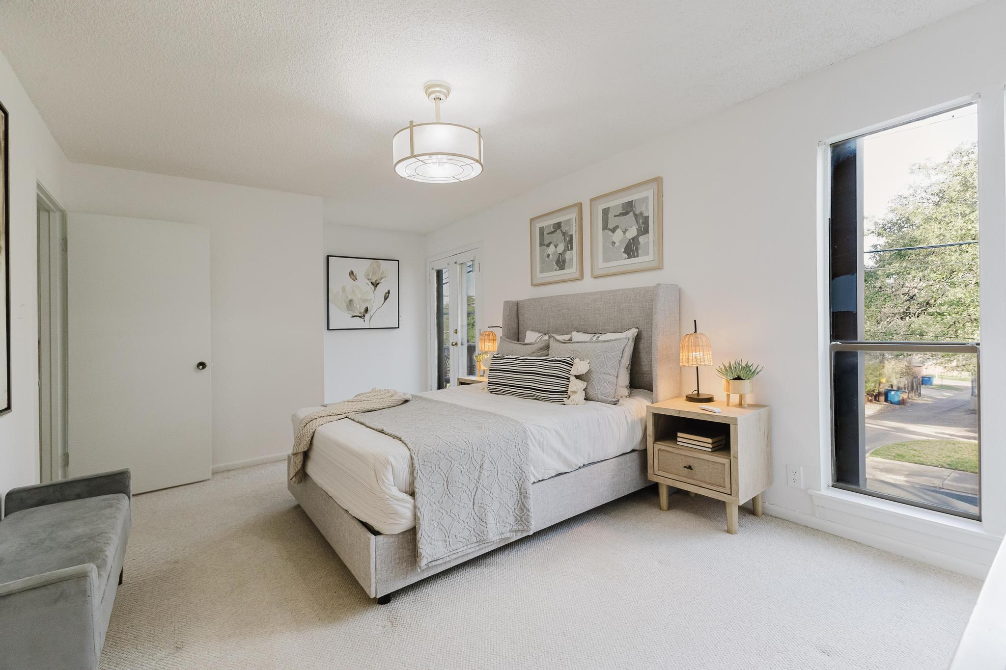 3500 Enfield Road, Unit F Austin, TX 78703 - Photo 12 of 22 a spacious bedroom with a bed and a window