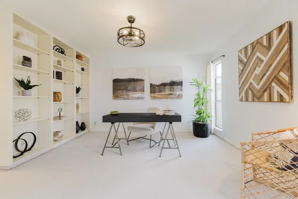 a living room with furniture and window