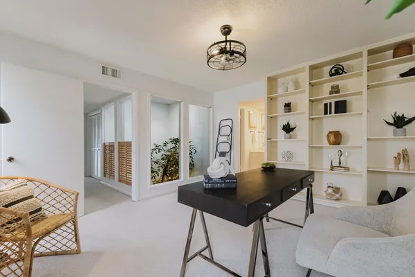a view of a livingroom with furniture and window