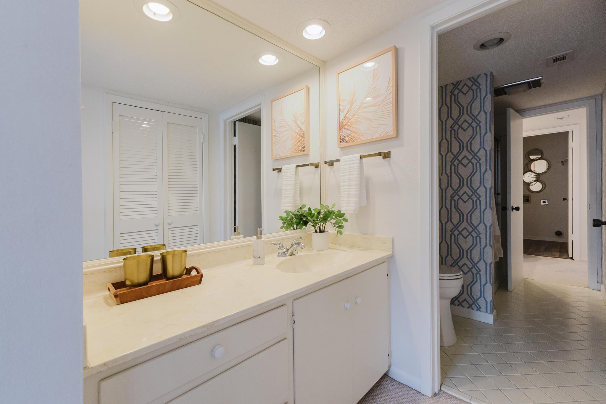 3500 Enfield Road, Unit F Austin, TX 78703 - Photo 18 of 22 a bathroom with a sink and a mirror