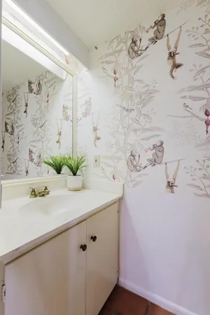 a bathroom with a sink and mirror
