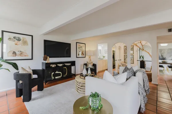 a living room with furniture and a flat screen tv