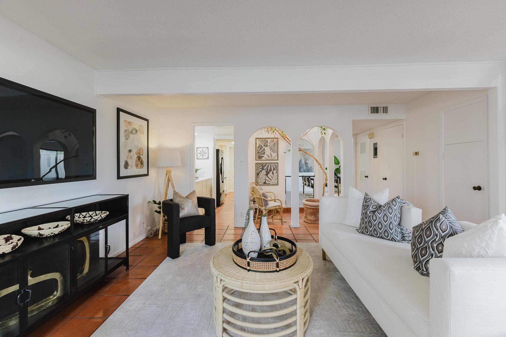 3500 Enfield Road, Unit F Austin, TX 78703 - Photo 3 of 22 a living room with furniture and a flat screen tv