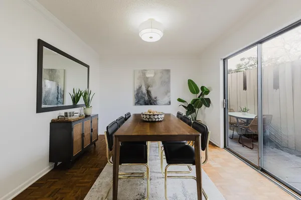 a dining room with furniture and window