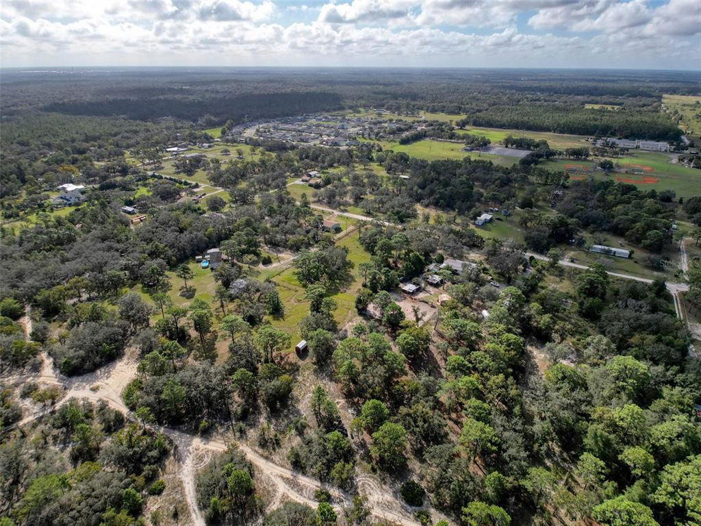 0 Smith Boulevard Hudson, FL 34667 - Photo 6 of 8 an aerial view of residential houses with outdoor space and trees