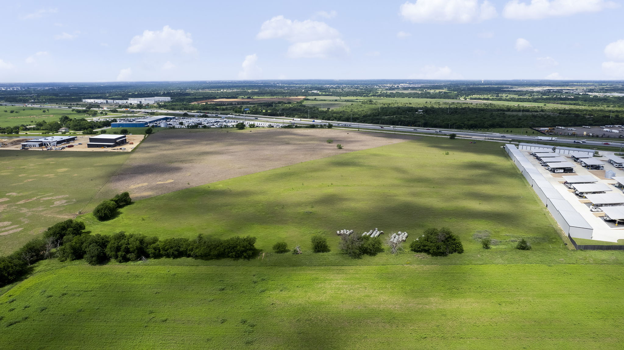 6100 Interstate 35 Georgetown, TX 78626 - Photo 8 of 11 Expansive undeveloped land parcel with visible highway access