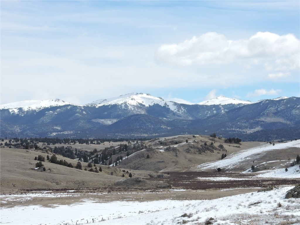 2017 Travois Road Jefferson, CO 80456 - Photo 1 of 14 a view of a mountain with a mountain in the background