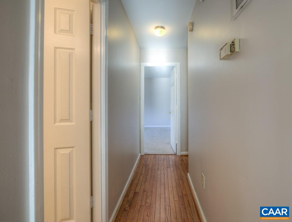 59 Narcissus Road Ruckersville, VA 22968 - Photo 11 of 35 a view of a hallway with wooden floor