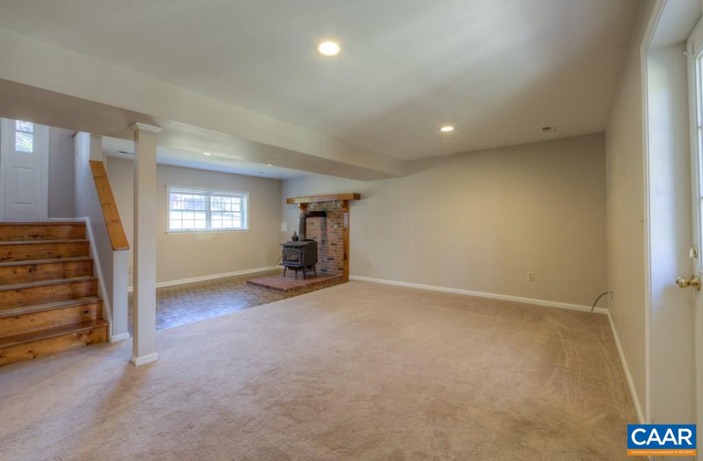 59 Narcissus Road Ruckersville, VA 22968 - Photo 18 of 35 an empty room with stairs and wooden floor