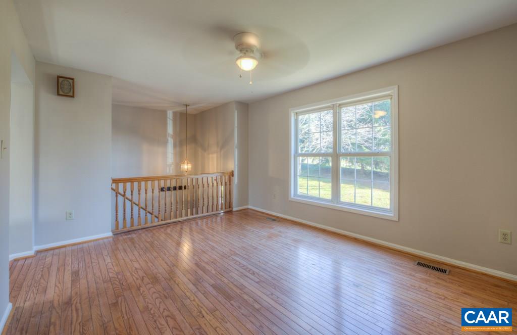 59 Narcissus Road Ruckersville, VA 22968 - Photo 4 of 35 a view of an empty room with wooden floor and a window