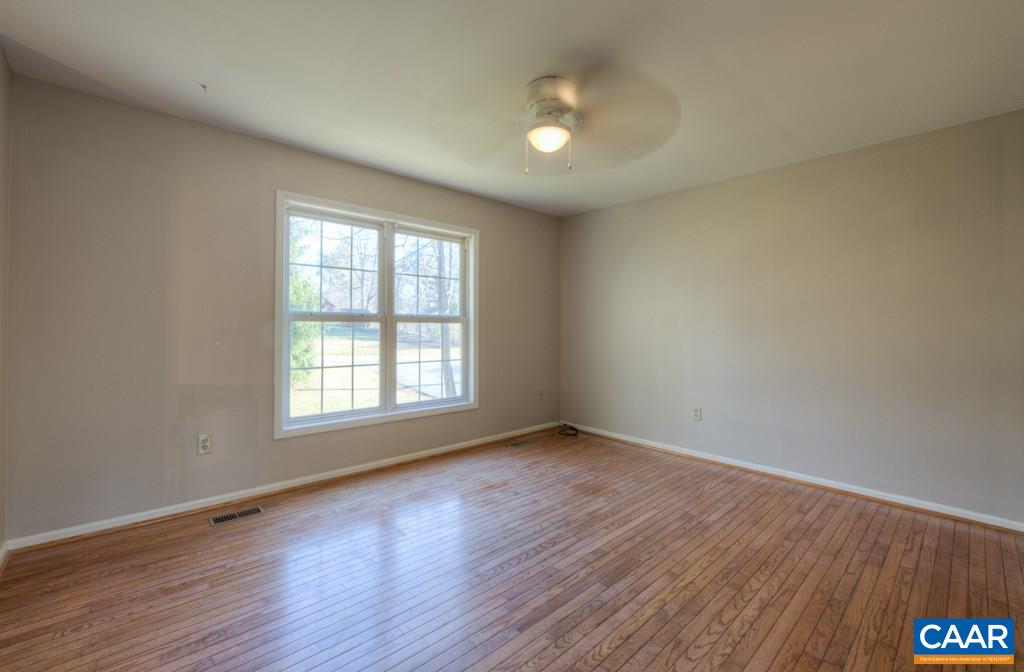 59 Narcissus Road Ruckersville, VA 22968 - Photo 6 of 35 an empty room with wooden floor and windows