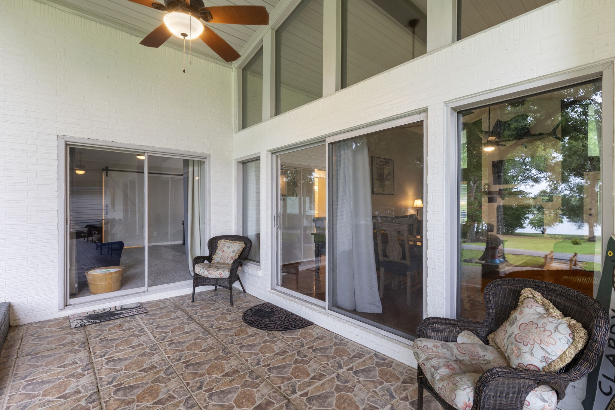 245 Lakeland Road Huntsville, TX 77320 - Photo 39 of 49 Glass doors leading to the primary bedroom, and dining/living room, creating a seamless indoor-outdoor living experience