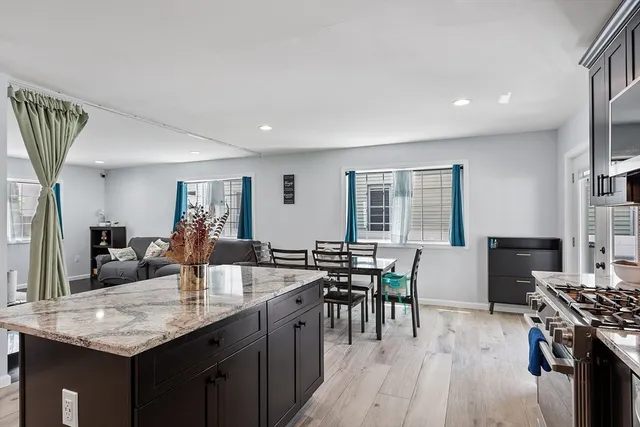 a kitchen with counter top space a sink appliances and cabinets
