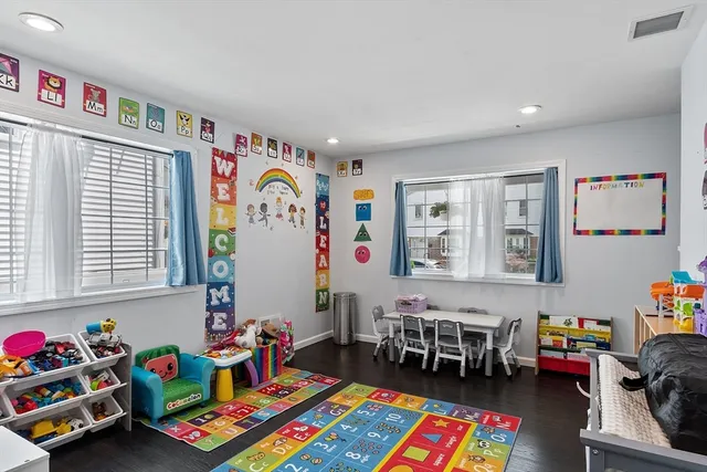a bed room with furniture and a window