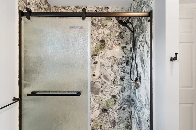 a bathroom with a shower and a shower curtain