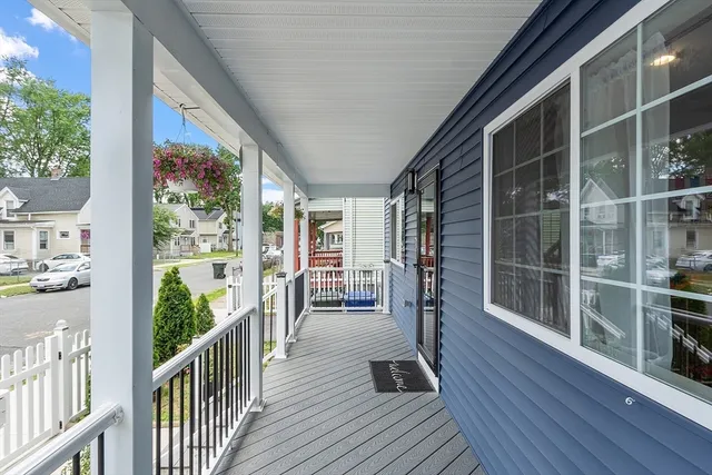 a view of a balcony with wooden floor