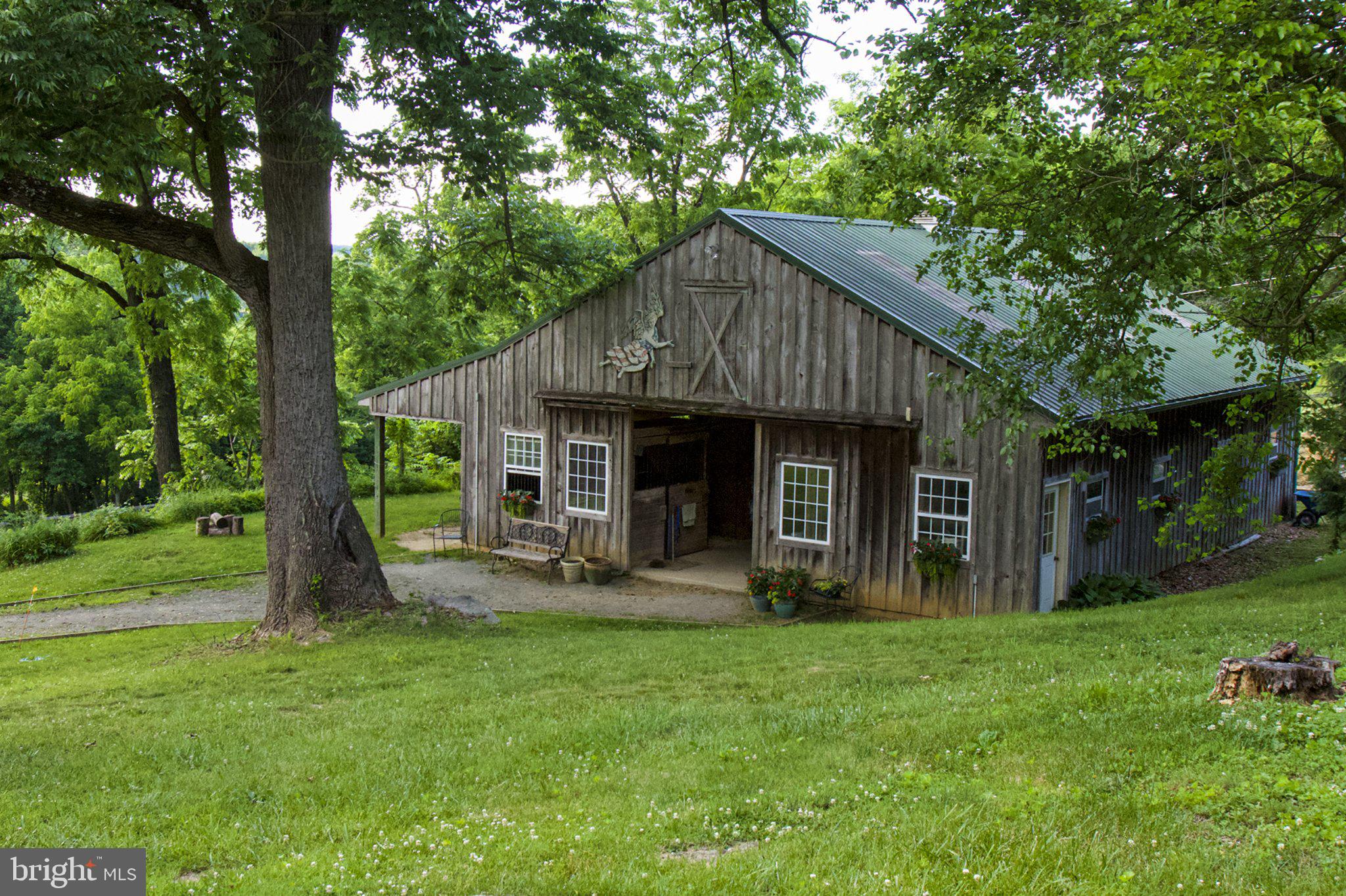 1646 Fairview Road Glenmoore, PA 19343 - Photo 22 of 29 Charming rustic barn amid lush greenery.