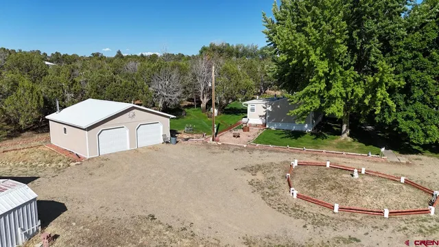 a view of a house with a yard and mountain view