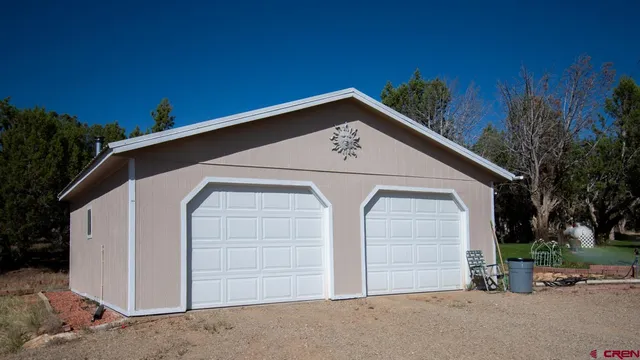 a view of a backyard with sitting area