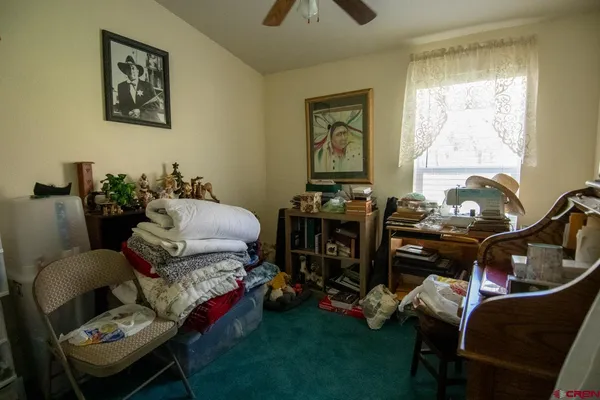 a bedroom with furniture and a window