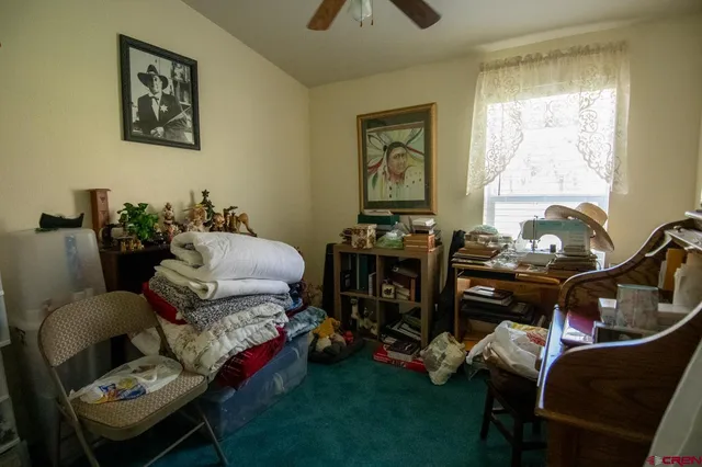 a bedroom with furniture and a window