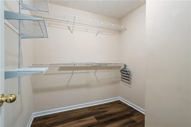 a view of storage and utility room with racks on the wall