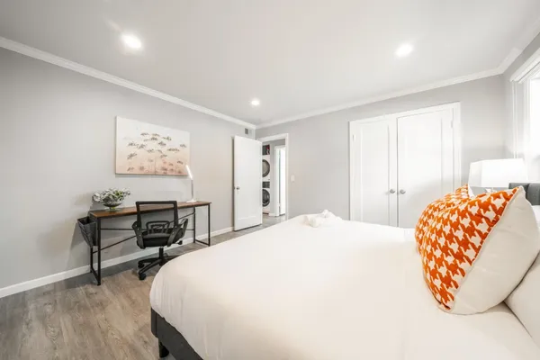 a bedroom with a bed and a table in it