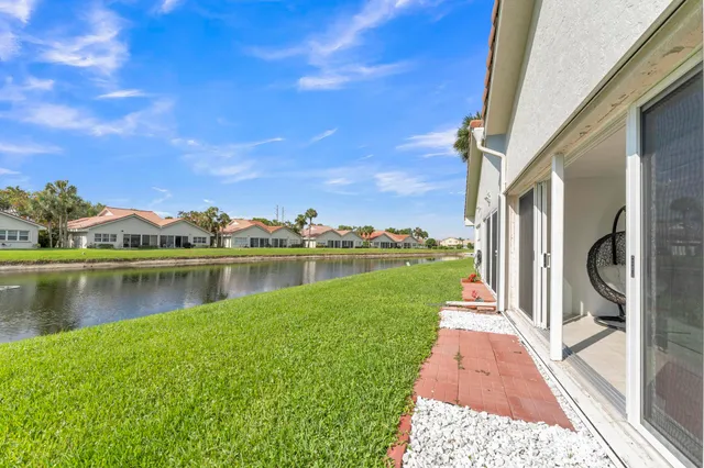 a view of a lake with a yard