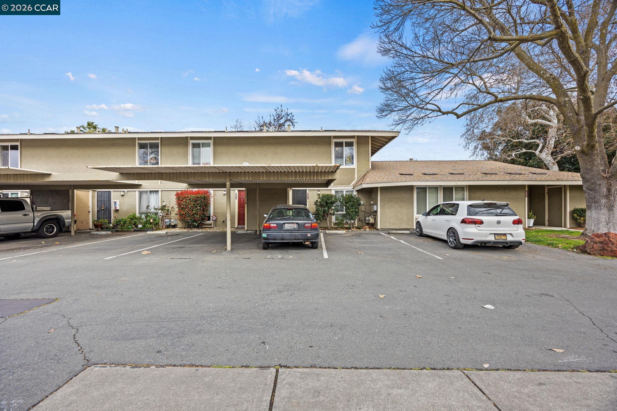 2069 Olivera Road, Unit E Concord, CA 94520 - Photo 18 of 18 a car parked in front of a building
