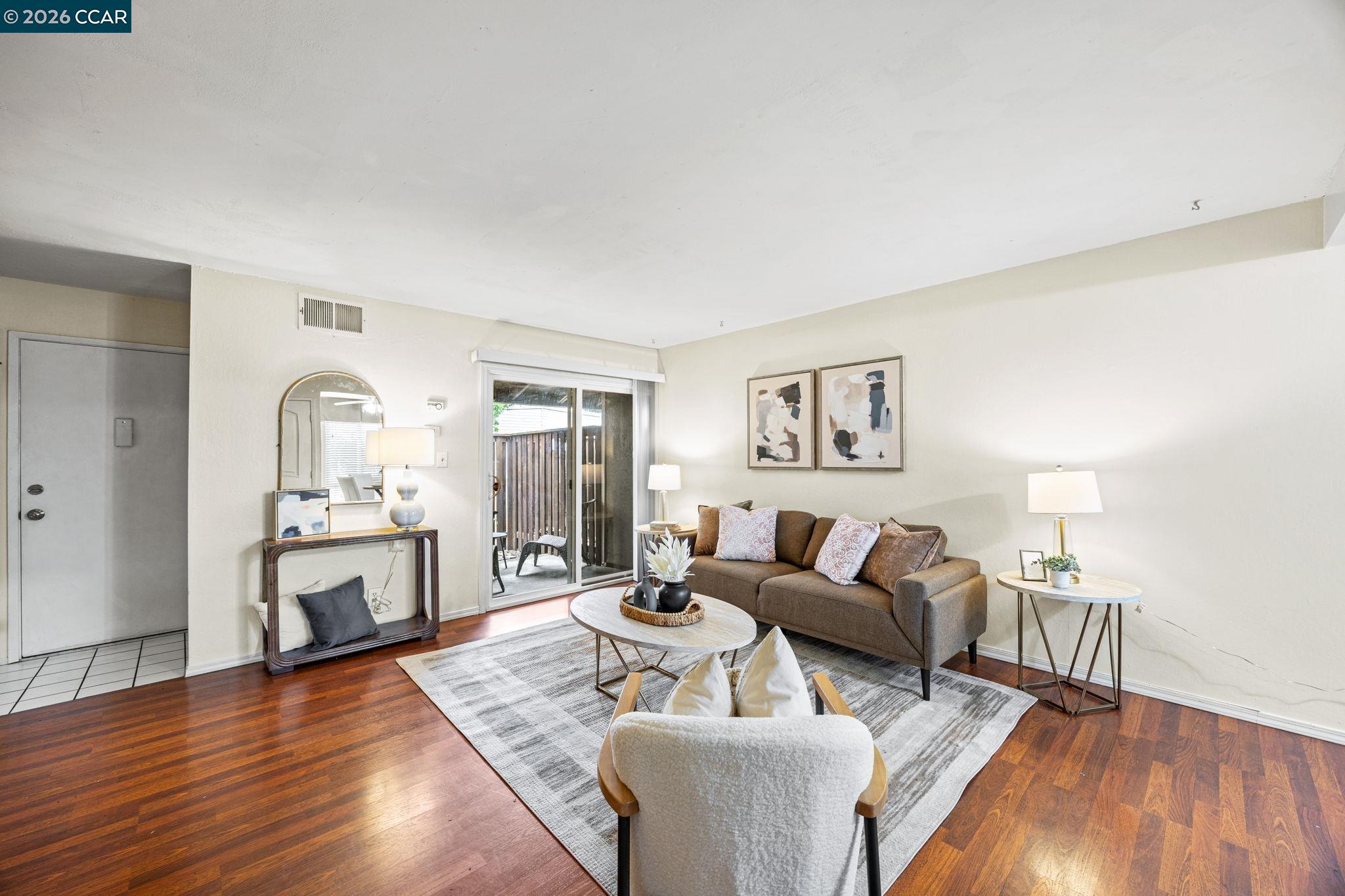2069 Olivera Road, Unit E Concord, CA 94520 - Photo 2 of 18 a living room with furniture and a fireplace
