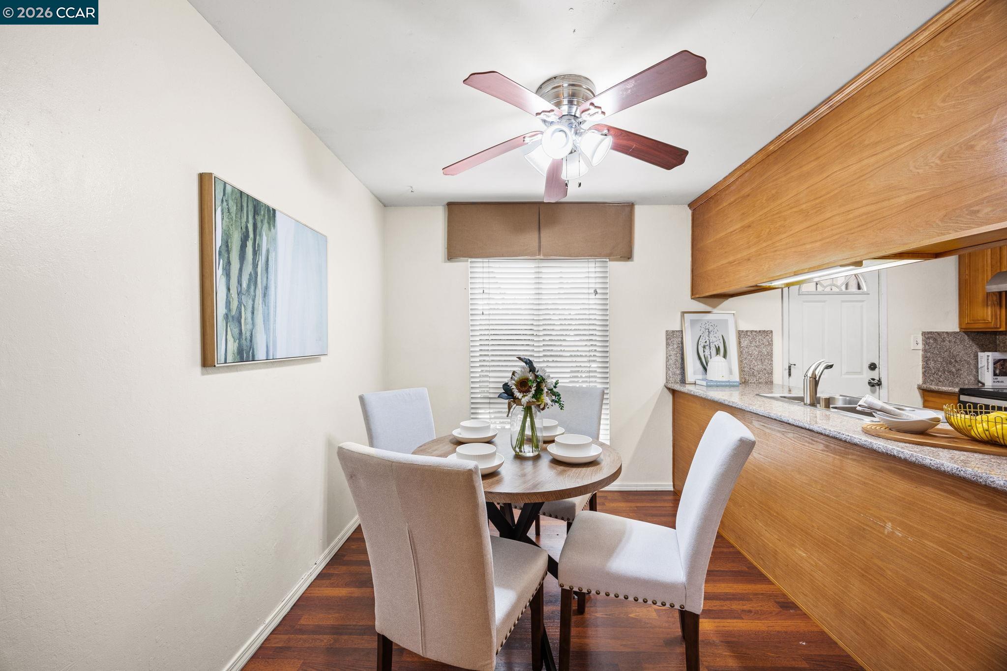 2069 Olivera Road, Unit E Concord, CA 94520 - Photo 4 of 18 a view of a dining room with furniture and wooden floor