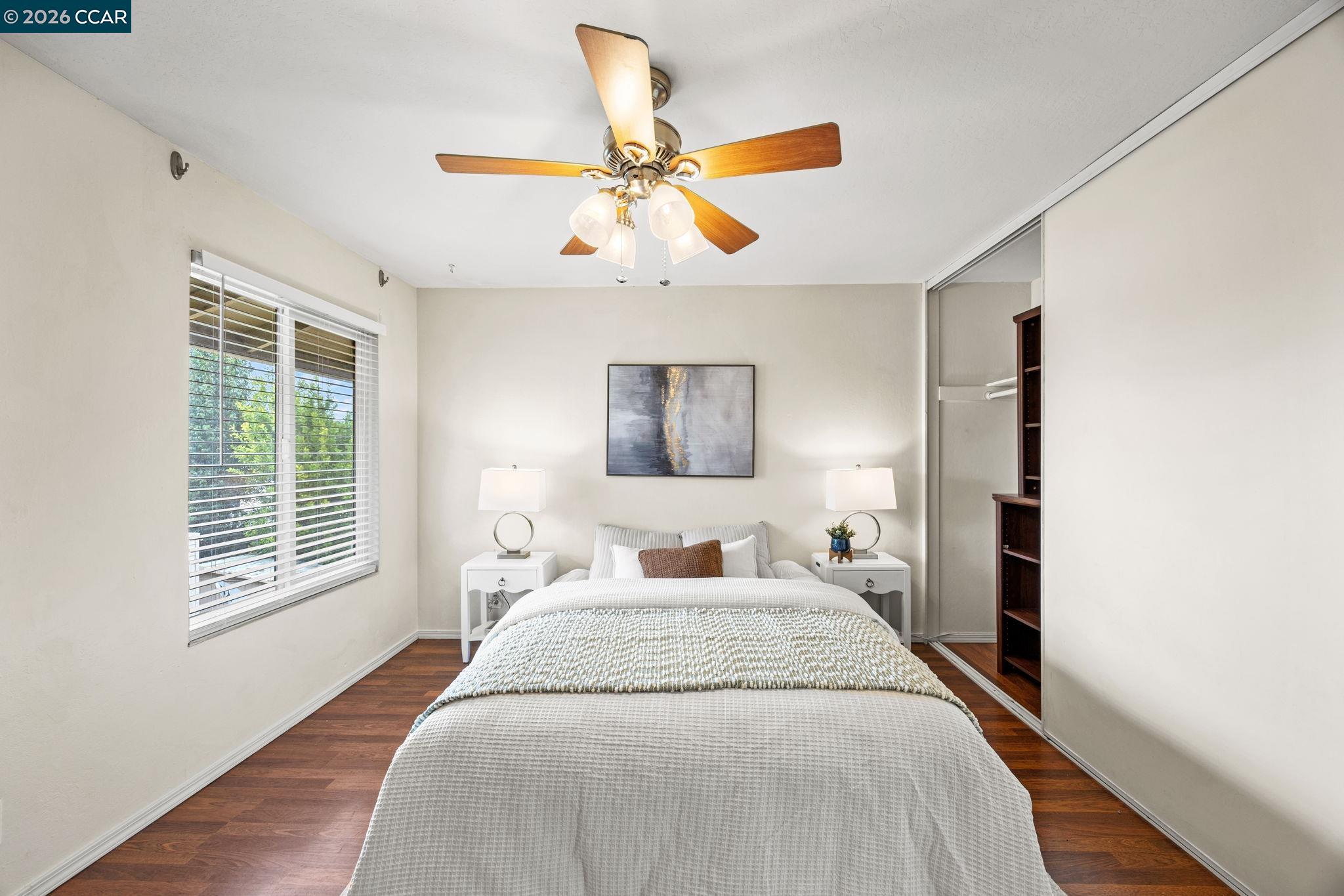 2069 Olivera Road, Unit E Concord, CA 94520 - Photo 9 of 18 a bedroom with a large bed and a window