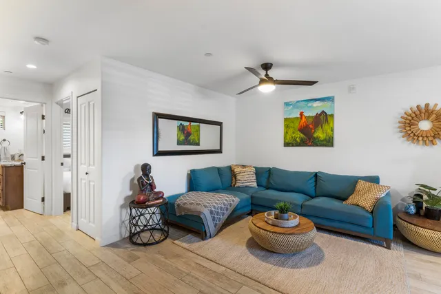 a living room with furniture and a rug