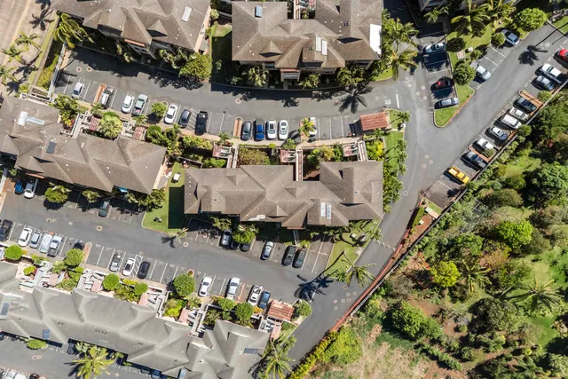 an aerial view of a houses with yard