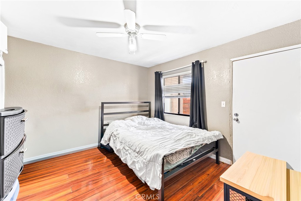 152 East Rosewood Street Rialto, CA 92376 - Photo 18 of 30 a bedroom with a bed and a dresser