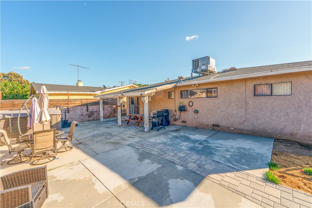 152 East Rosewood Street Rialto, CA 92376 - Photo 25 of 30 a view of a house with backyard and sitting area