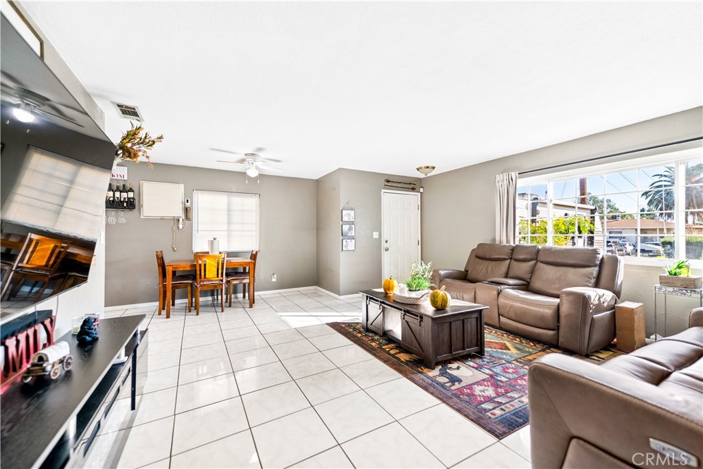 152 East Rosewood Street Rialto, CA 92376 - Photo 5 of 30 a living room with furniture and a flat screen tv