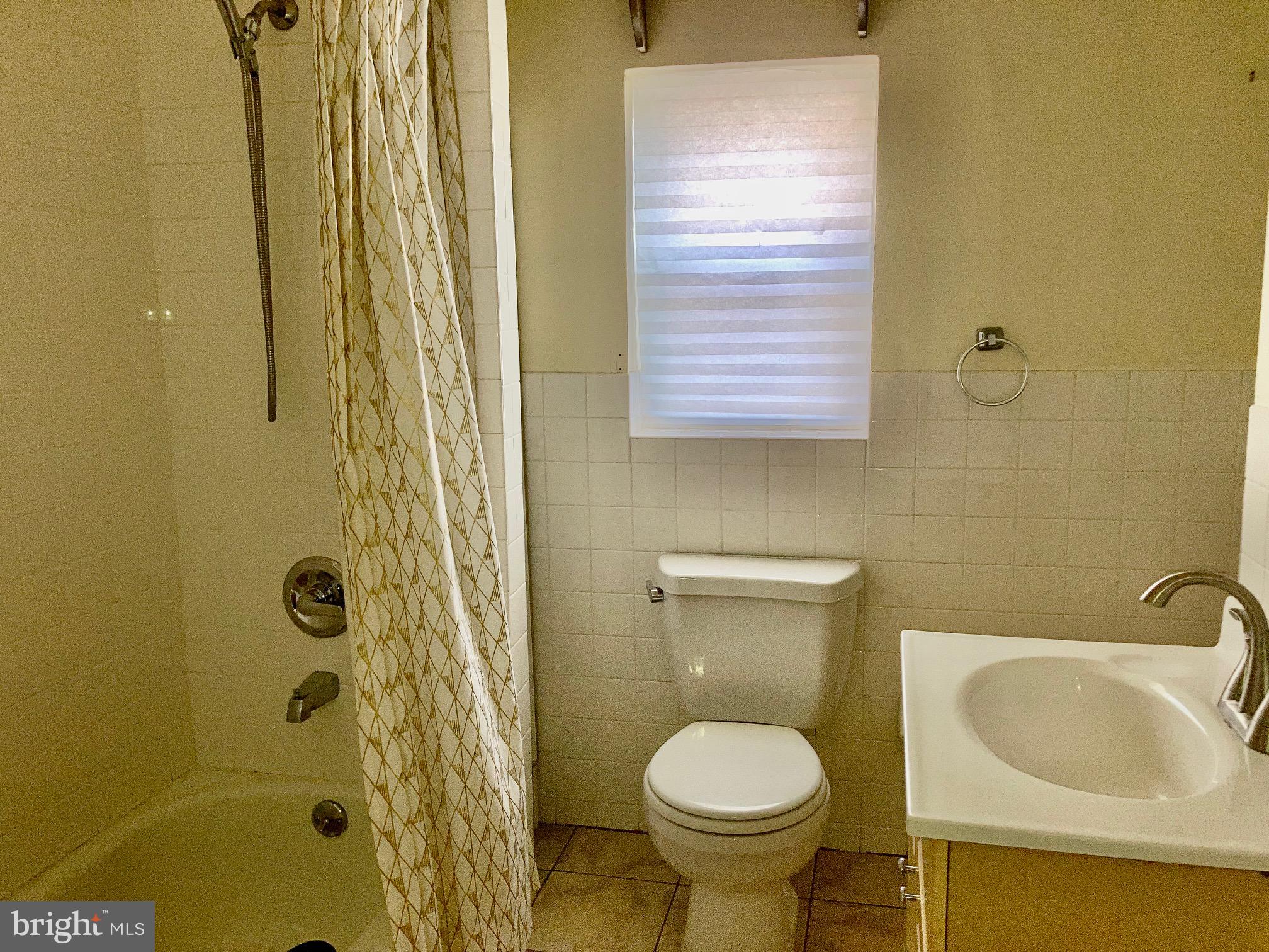 1122 South Broad Street, Unit 2R Philadelphia, PA 19146 - Photo 10 of 10 a bathroom with a sink and a toilet